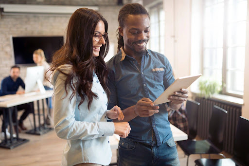 Two people looking at a document